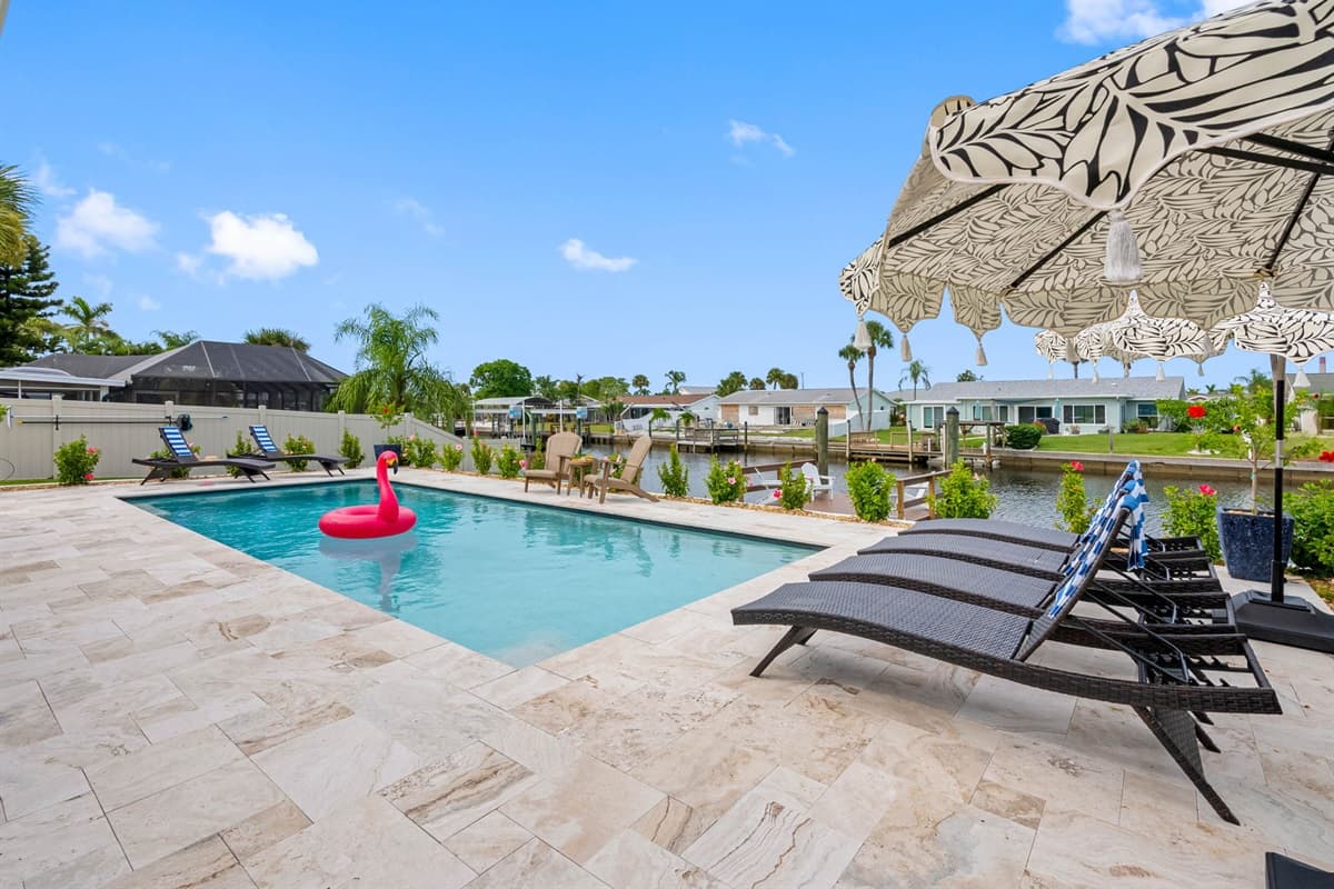 Enjoy four comfortable loungers and shade umbrellas for all-day comfort.