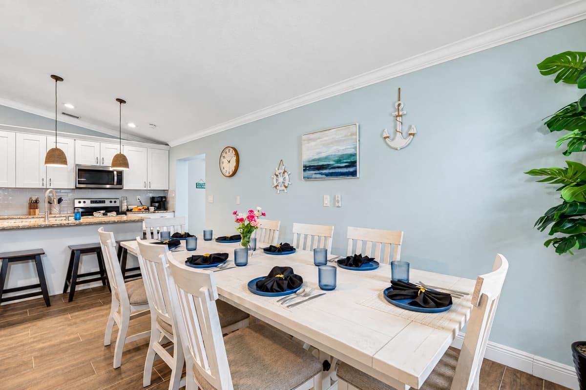 With its strategic location, the dining table allows for seamless interaction between the kitchen and dining areas, making meal service and cleanup effortless.
