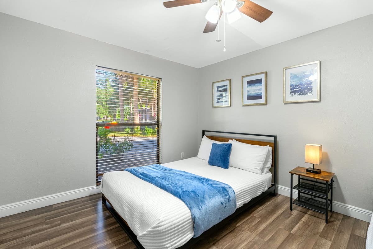 A warm, inviting room with a queen bed and bunks to accommodate the whole crew.
