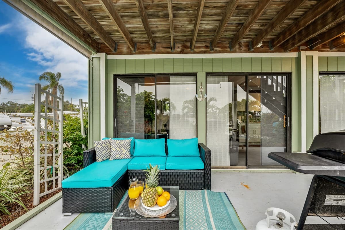 Take a seat on the comfortable outdoor furniture and let the tranquil ambiance wash over you.