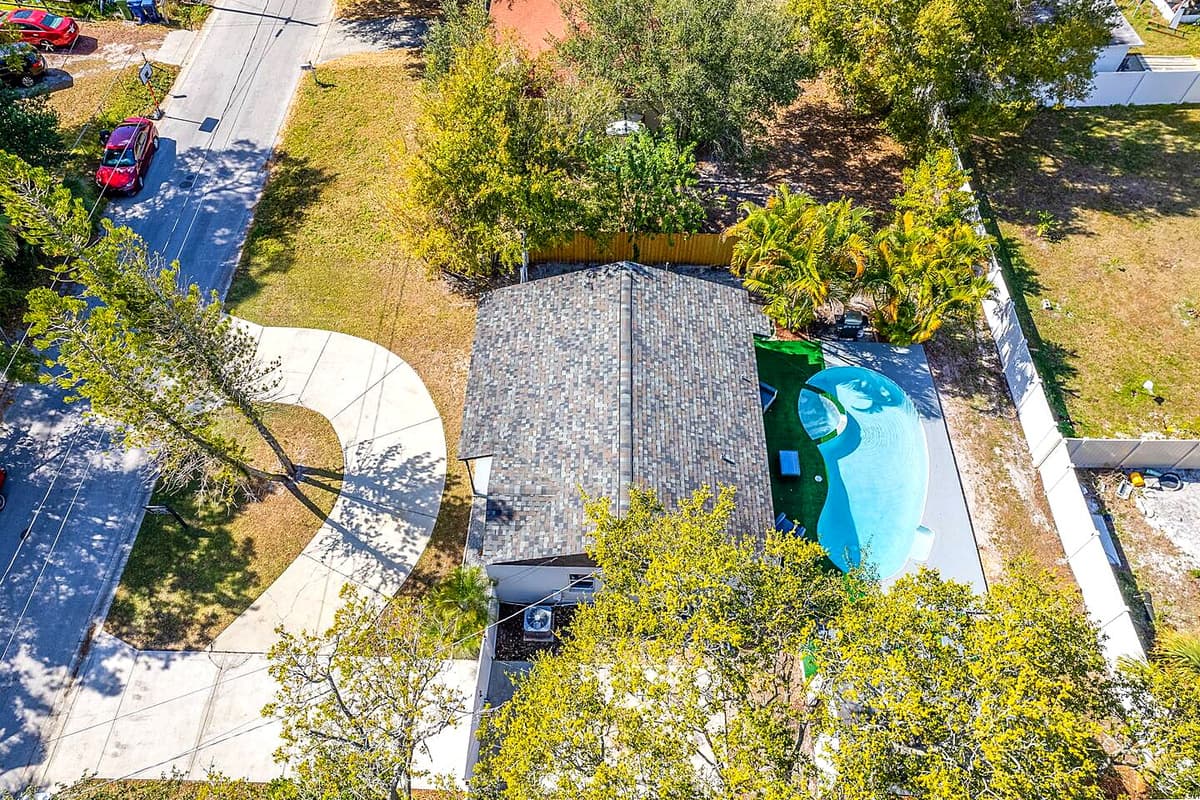 Top view of our lovely property showcasing the stunning heated pool and lounge area at the back of the property. Love what you see? Ask us questions and send us an inquiry as soon as possible!