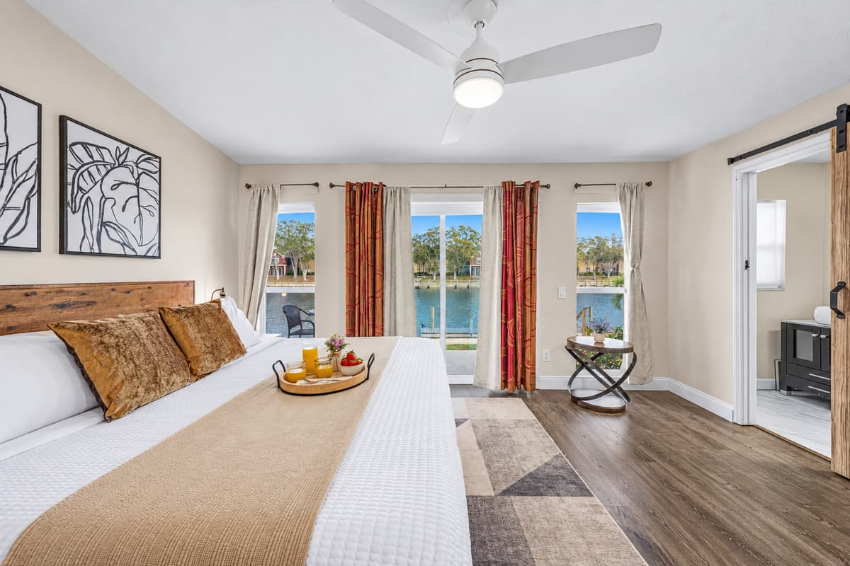 Wake up to tranquil water views from this spacious king bedroom.
