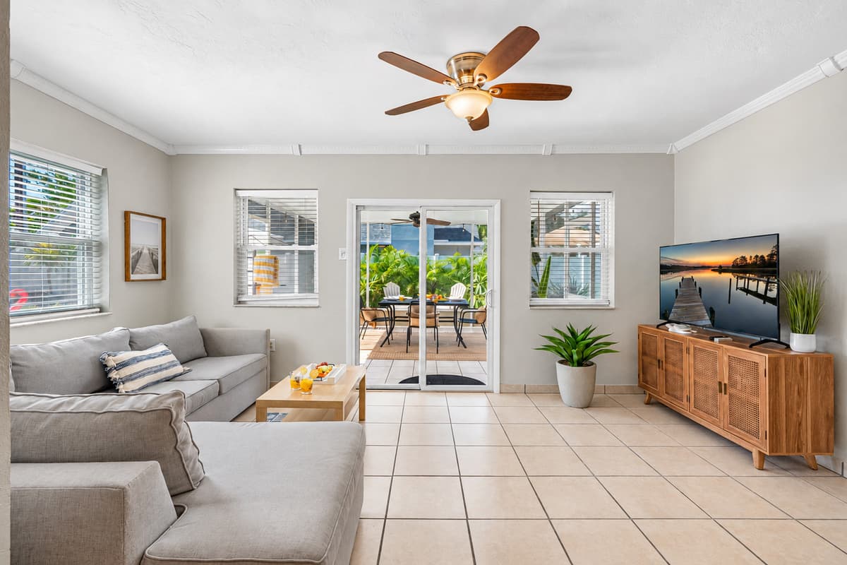 Feel instantly at home in this peaceful living space, where a calming color palette and soft seating invite you to relax.