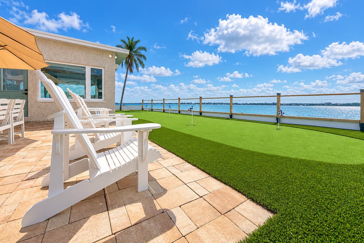 Waterfront patio with outdoor dining and places to relax.