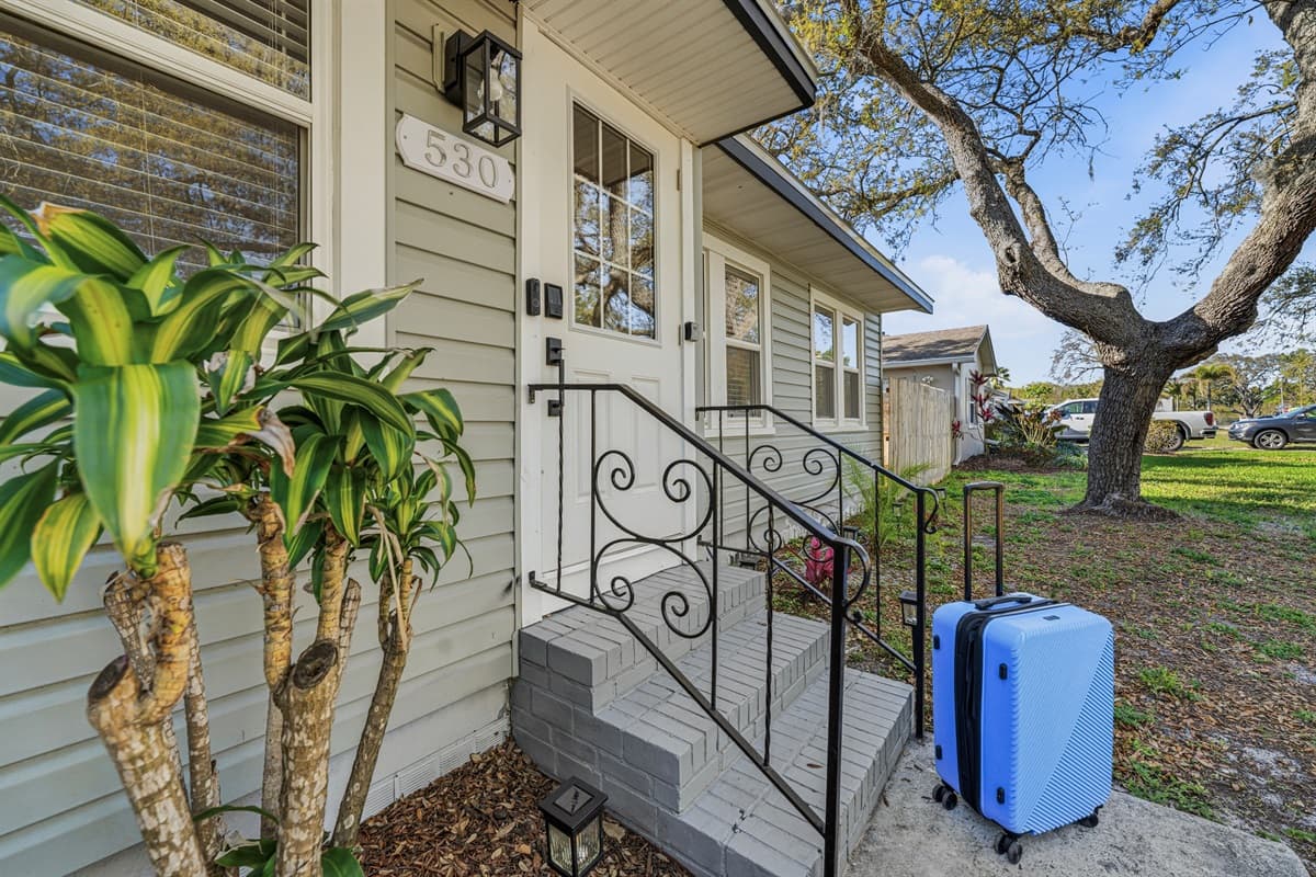 Charming front porch with steps and welcoming entry.