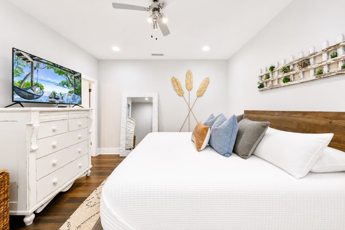 Unwind in the beautifully furnished primary suite with a king bed, Smart TV, and calming ambiance.