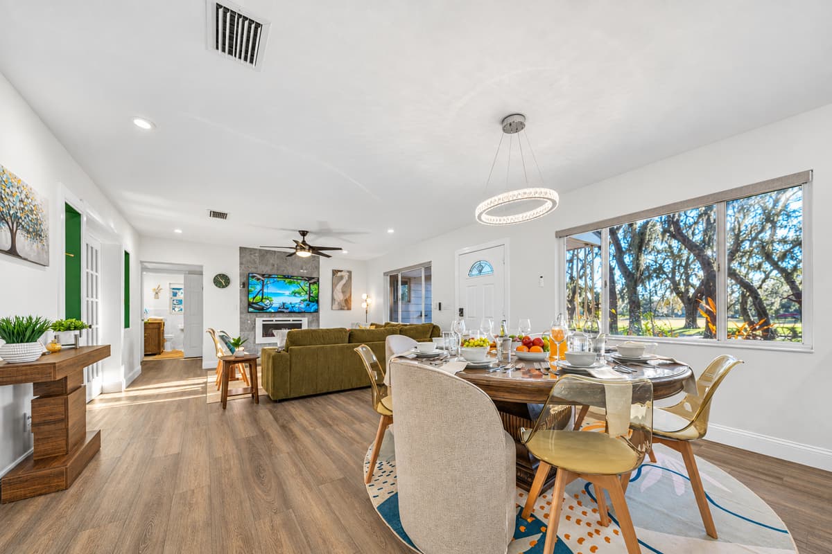 Gather around the spacious dining table and enjoy meals in a setting that feels both upscale and relaxed.