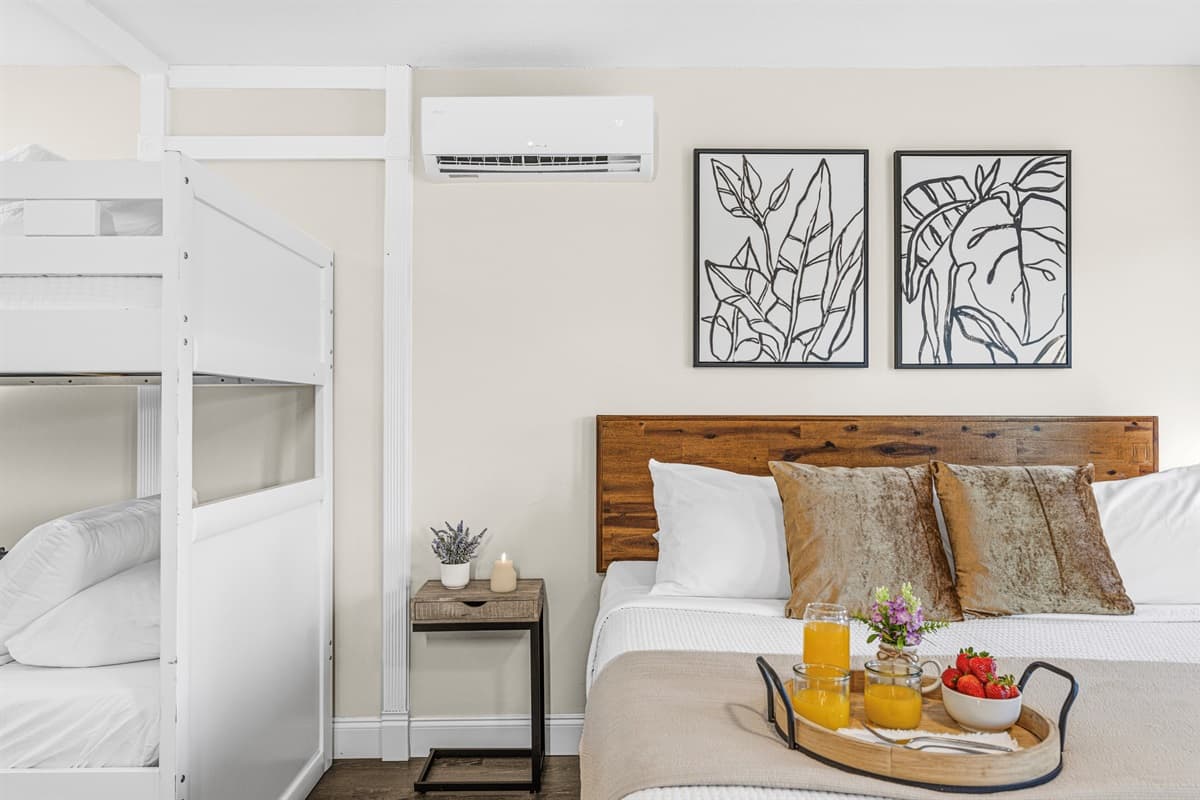 Family-friendly bedroom with a king bed and built-in twin bunk beds.