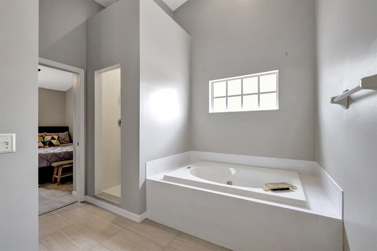 As you enter, you'll be greeted by an elegant bathtub, inviting you to immerse yourself in a soothing bubble bath or indulge in a moment of quiet contemplation.