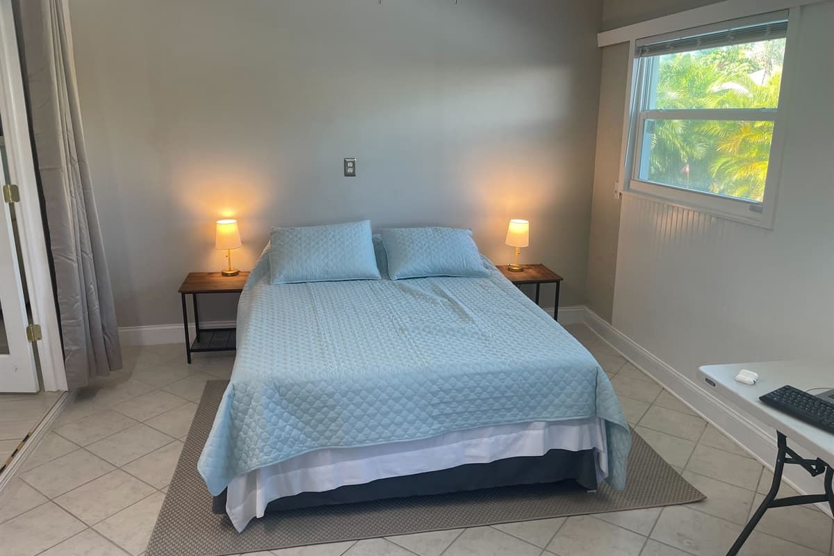 Soft lighting and plush bedding create a cozy and inviting atmosphere, ensuring a relaxing stay.