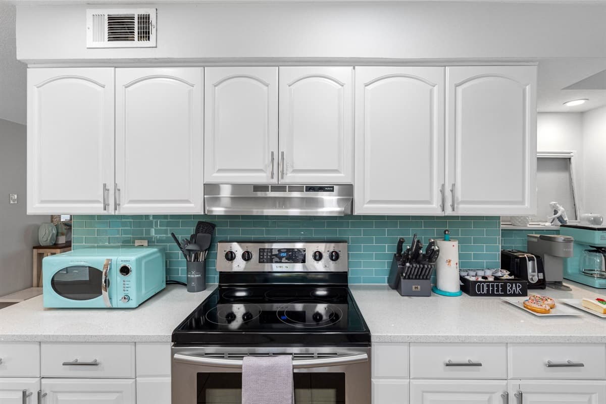 Every detail, from the coastal color scheme to the thoughtfully placed amenities, makes this kitchen a pleasant, inviting space.