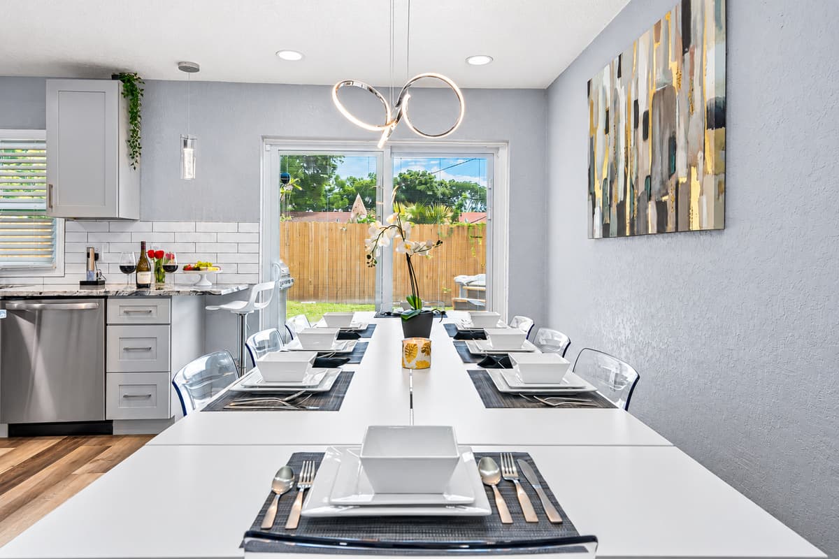 Eight seats, one table, every meal together. Clear acrylic chairs and a long white table seat up to eight. Share takeout or a home-cooked feast and keep the whole group at one table.