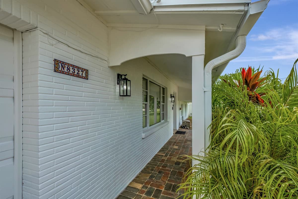 With its warm, welcoming color palette and tastefully landscaped surroundings, this home beckons you with open arms.