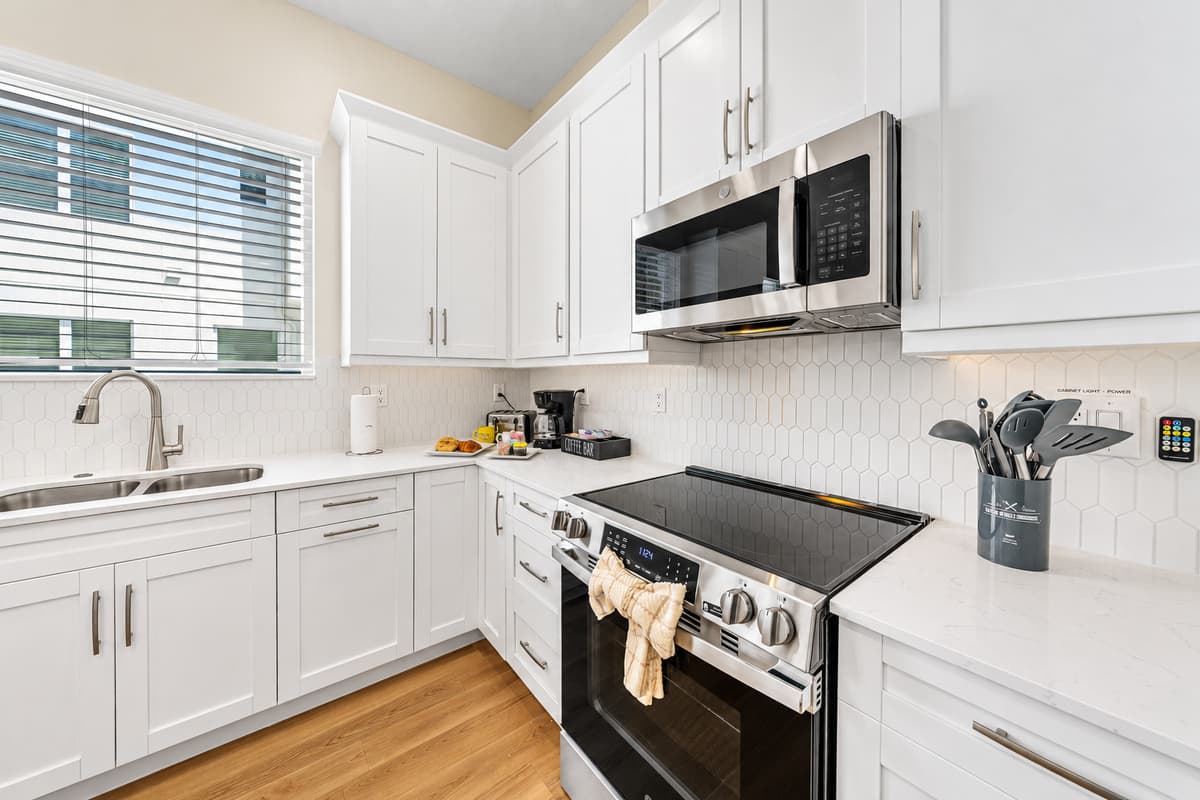 Bright kitchen with ample counter space and modern appliances for easy cooking.