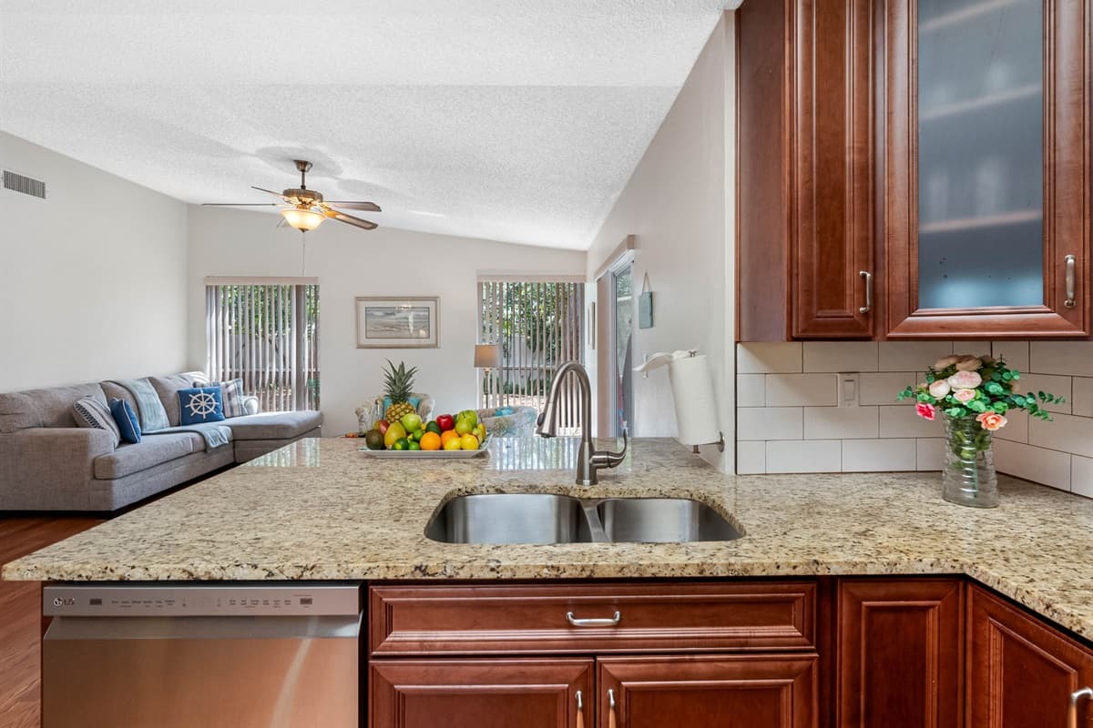 You'll find modern, full-sized appliances, including a refrigerator with freezer, a smooth-top stove and oven, a built-in microwave, and a dishwasher for easy clean-up after meals.