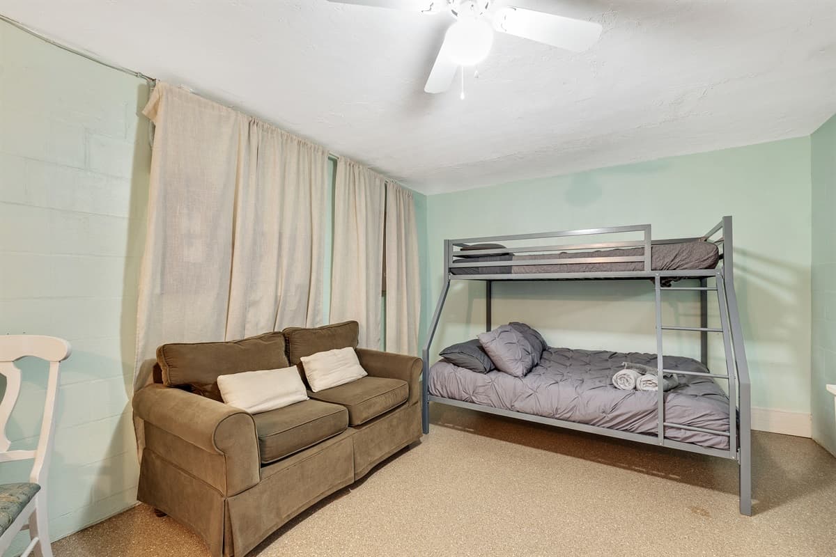 Embark on an extraordinary experience as you enter this exceptional bedroom, carefully curated to offer a perfect blend of comfort and entertainment.