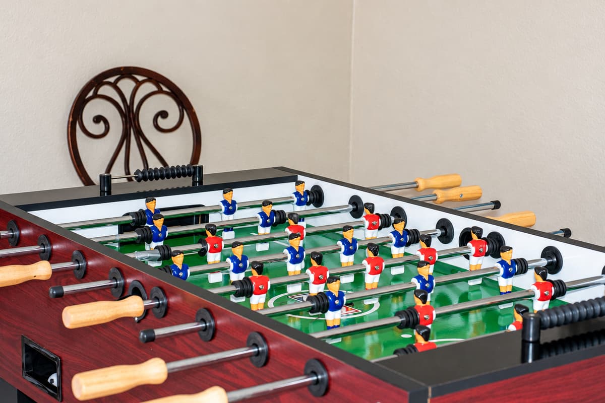 Bring the whole crew together in this spacious game and dining area featuring tile floors, stylish décor, and games that’ll keep everyone entertained.