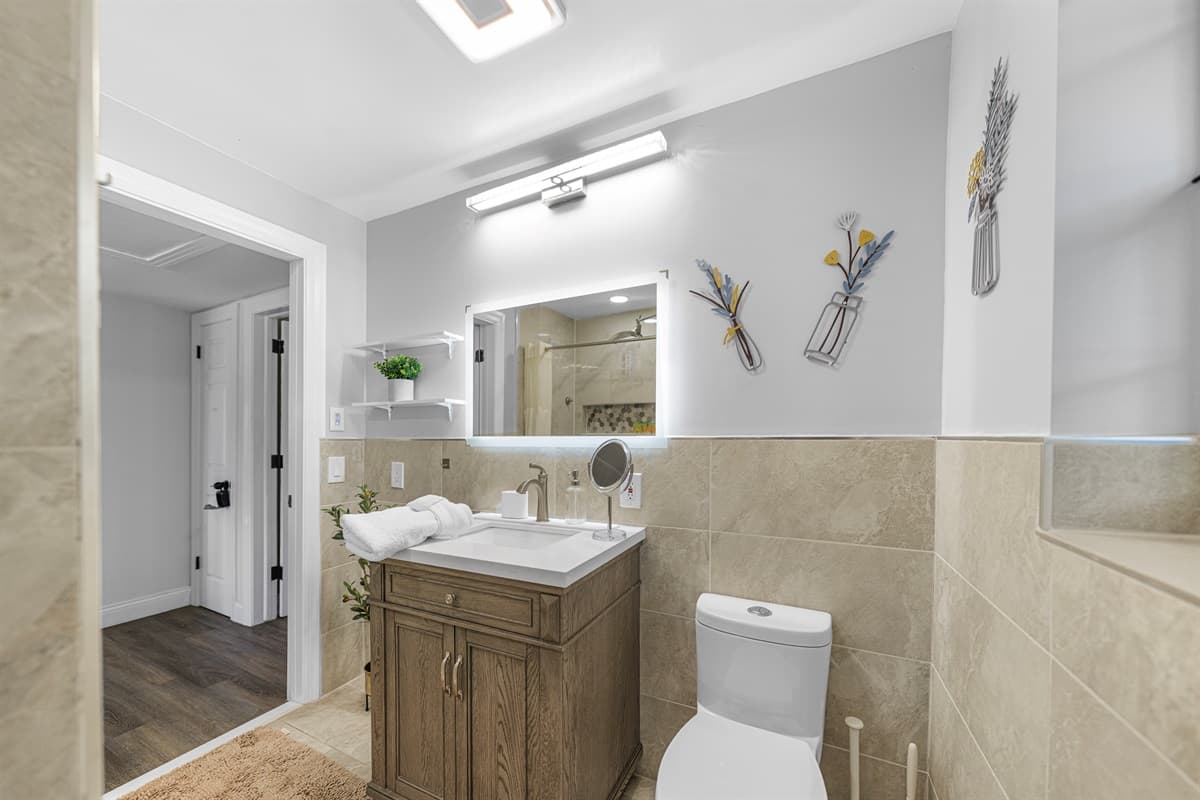 Designed for comfort and relaxation, this bathroom includes a spacious shower and tasteful, modern décor.