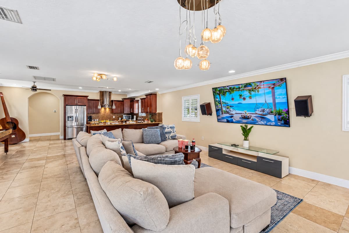 This welcoming space features a spacious, plush sectional sofa, perfect for stretching out and relaxing after a day of exploring, swimming, or sightseeing.
