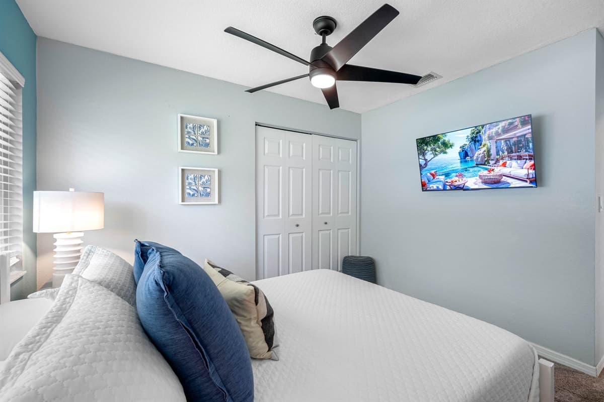 This queen bedroom blends clean lines, soft lighting, and ocean-inspired tones for a soothing night’s rest.