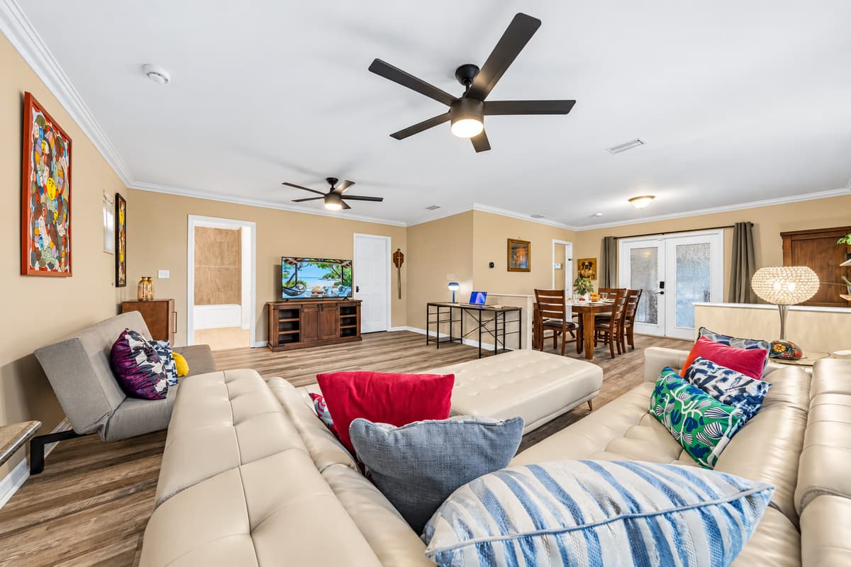 Expansive living area with ample seating, open layout, and modern finishes—great for groups and families.