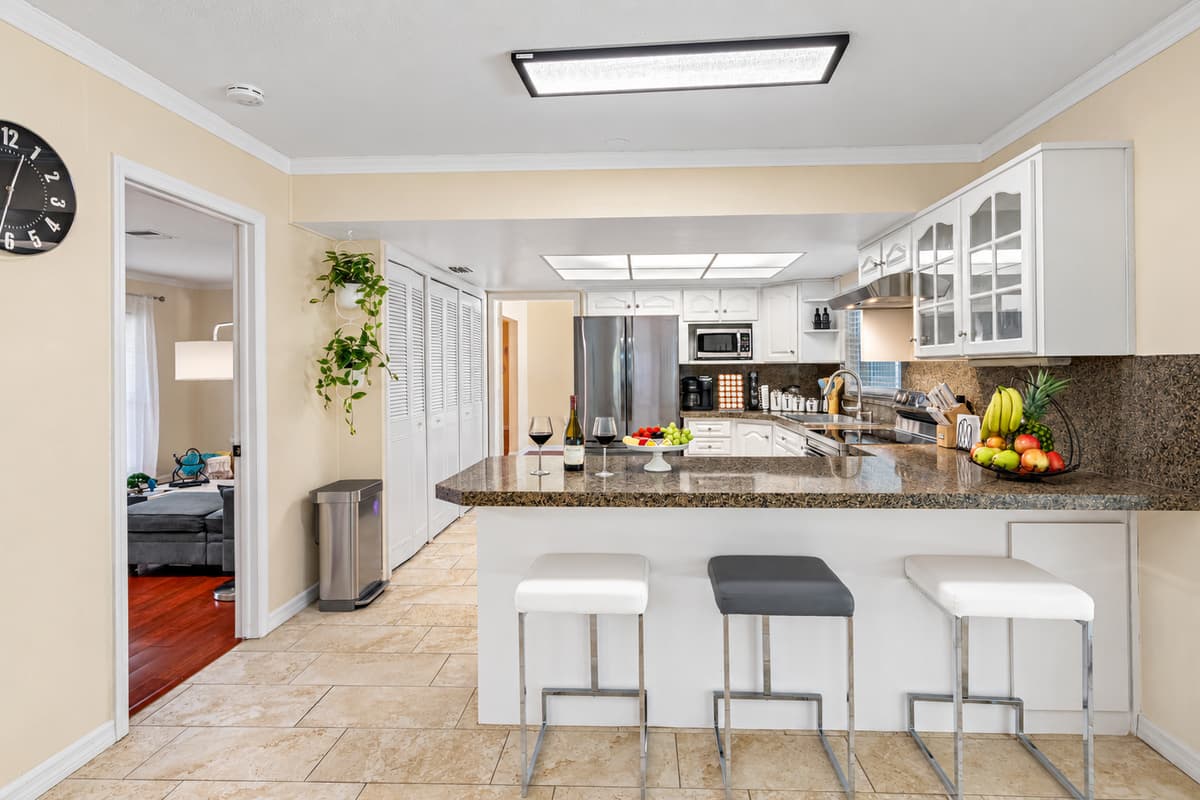 Crisp, clean lines and modern finishes make this kitchen a true showstopper, while still maintaining a warm and welcoming vibe.