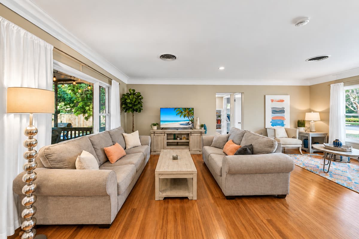 Comfortable living room with plush seating, large TV, and an open-concept layout perfect for relaxing.