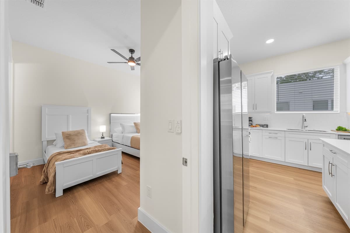 Conveniently located just off the kitchen, this bedroom offers easy access to everything while maintaining total privacy.