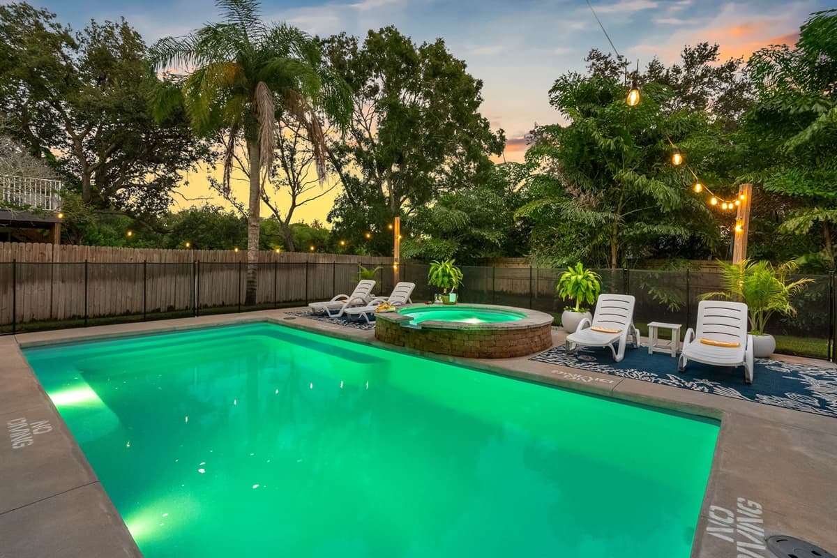 Cool off in the pool or lounge under the deck’s shade — this backyard oasis is ideal for both fun and relaxation.