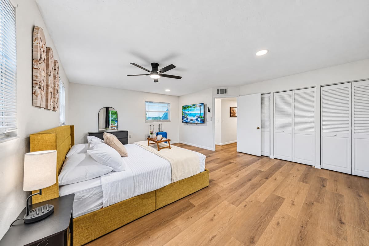 Spacious bedroom featuring a king bed, large closet space, and open layout for added comfort 