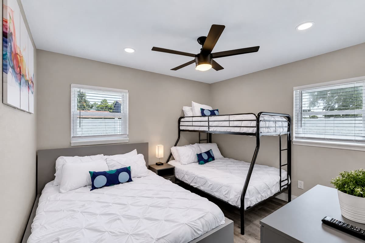 Immaculate bedroom with single over twin bunkbed, queen sized bed, drawers for storage and smart TV. Great room for families with kids or group of friends. If you feel like this place is for you, send us an inquiry now!