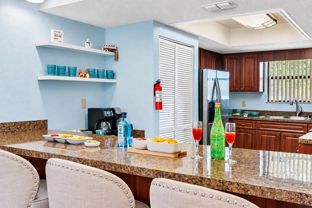 The countertops are made from gorgeous granite, offering a durable and heat-resistant surface for meal prep.