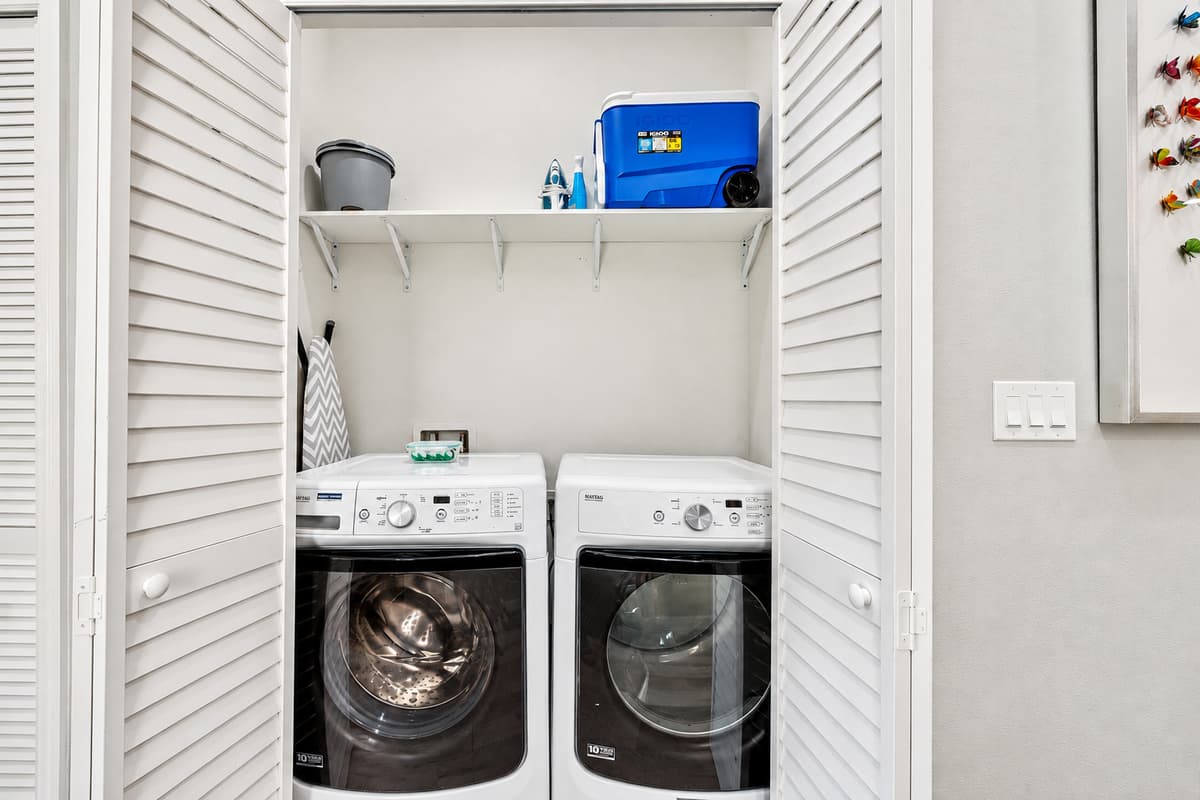 This room is your haven for quick and convenient laundering. Efficiency meets comfort in this contemporary laundry space.