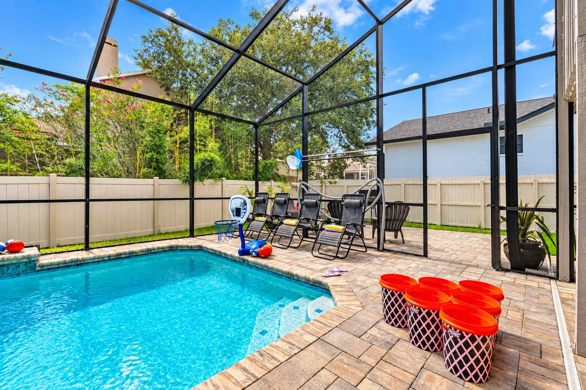 Float the day away on a whimsical unicorn, splash under the soothing waterfall, or shoot hoops poolside—this backyard oasis is made for memories.