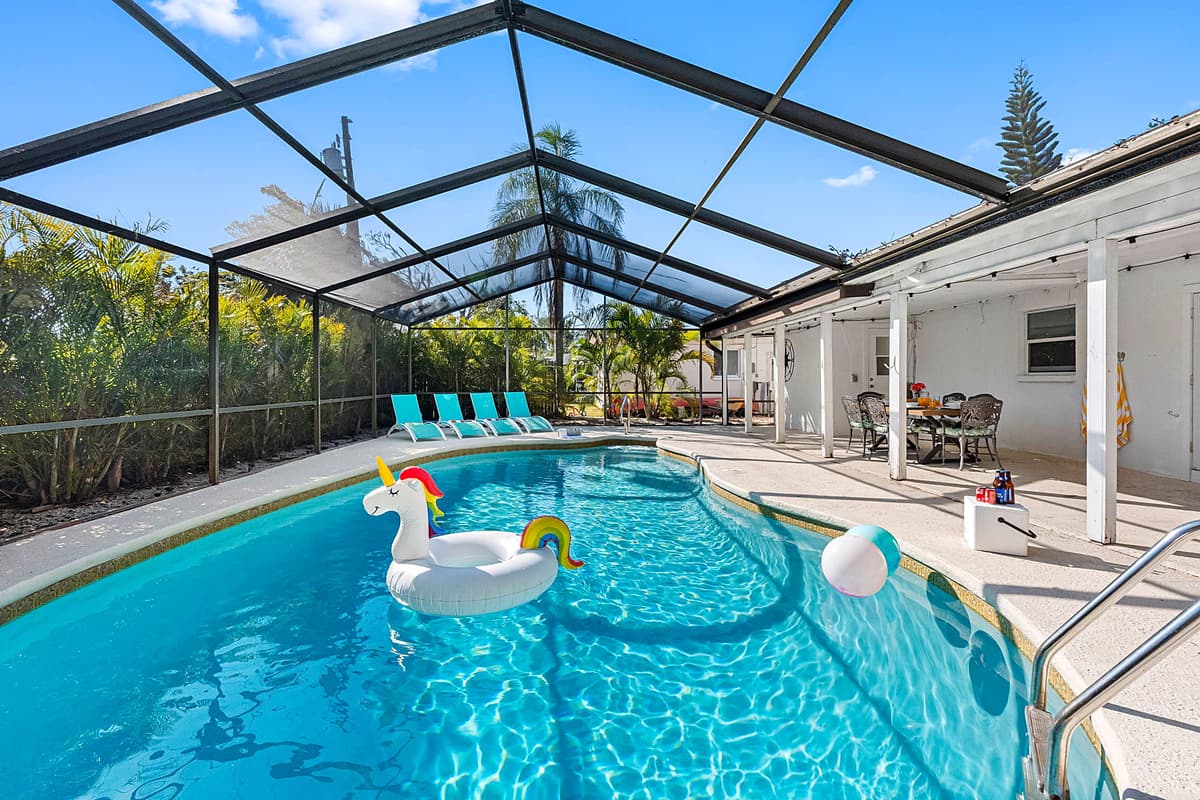 Designed to blend relaxation and style, this inviting outdoor space offers a heated swimming pool.