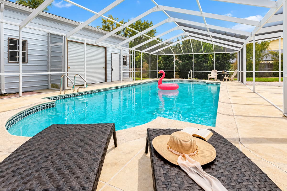 Cool off in this private backyard pool, surrounded by a peaceful outdoor setting.
