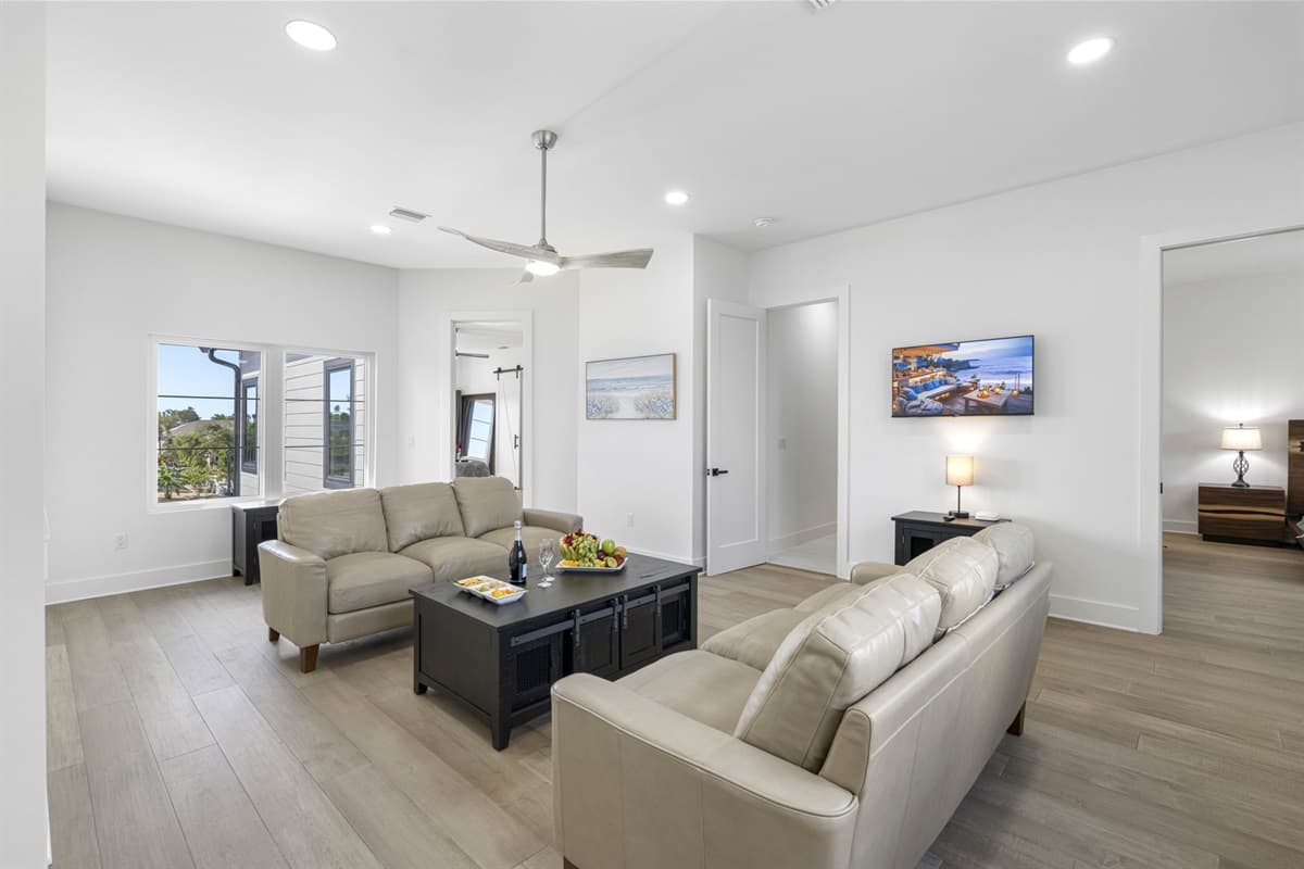 The secondary living room offers a more intimate setting for quiet conversations or peaceful downtime.