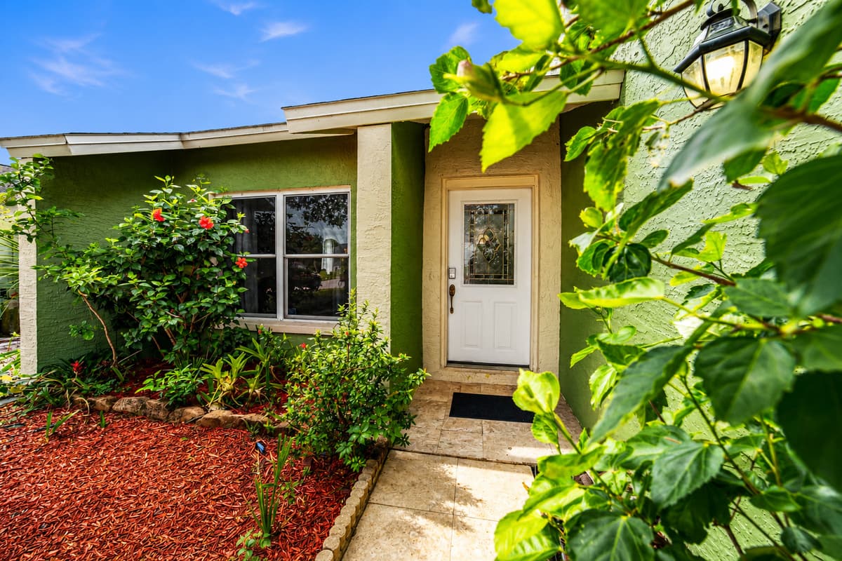 Peaceful garden path leading to the home's entrance, creating a warm first impression.