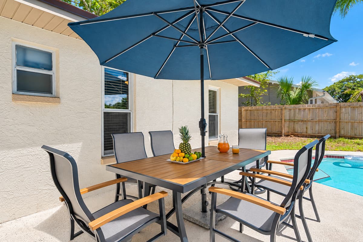 For those who enjoy dining al fresco, the pool area features a charming patio equipped with outdoor seating.