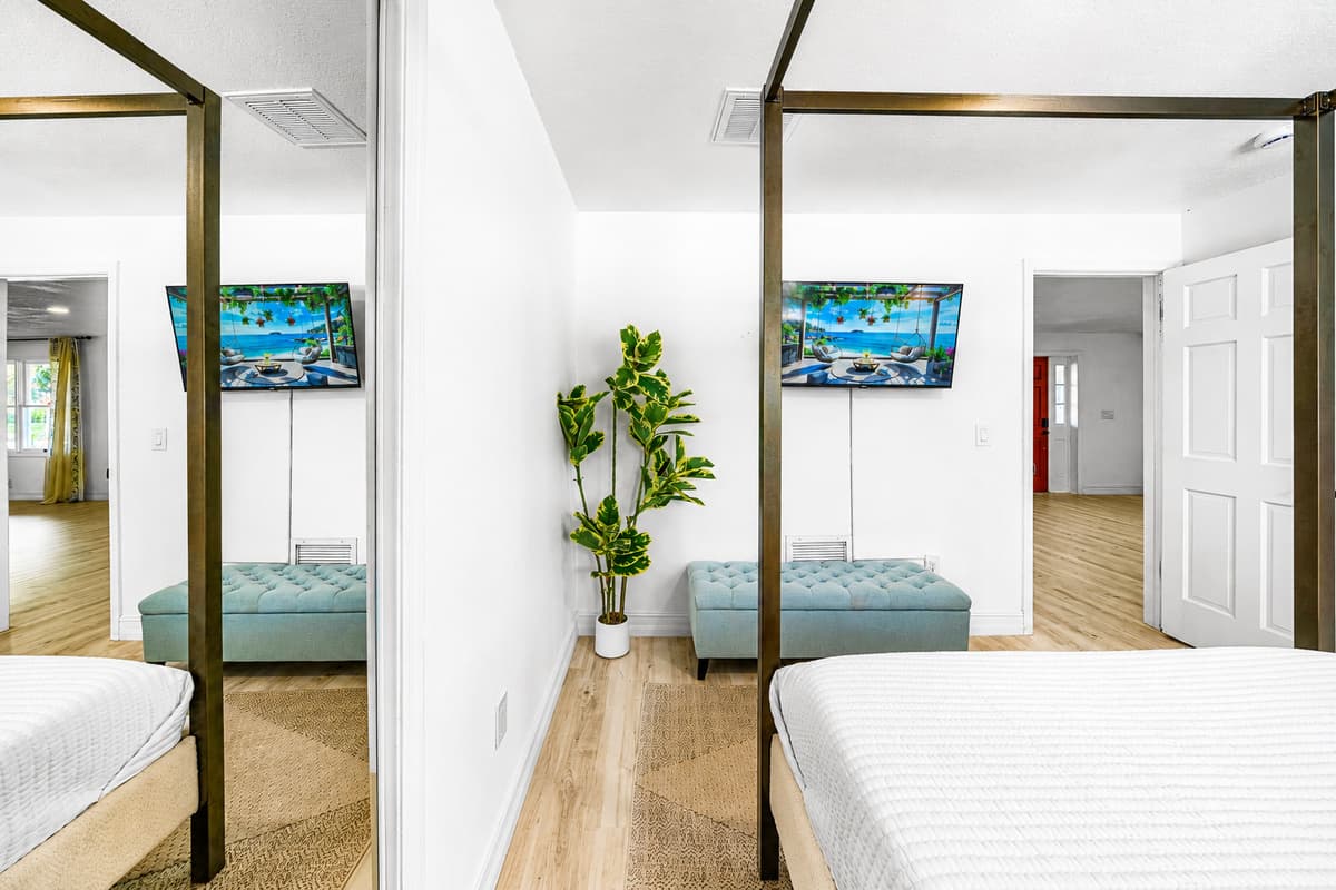 Two beds, two TVs, one door between them — split the group without splitting the house.