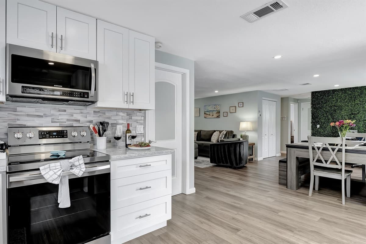 Our stunning kitchen, a masterpiece of clean, sleek design.