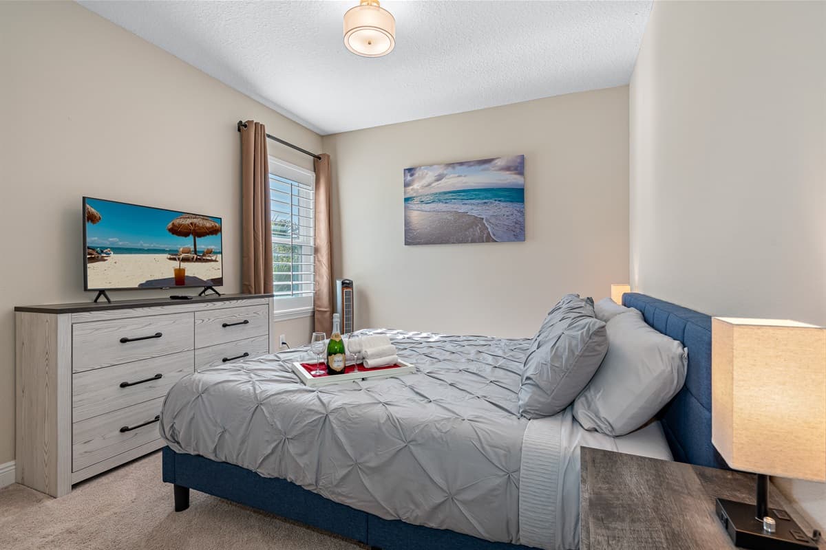 Feel comfortable during your stay while making wonderful memories with family and friends. Exquisite bedroom with king size bed, drawers, and smart TV. 