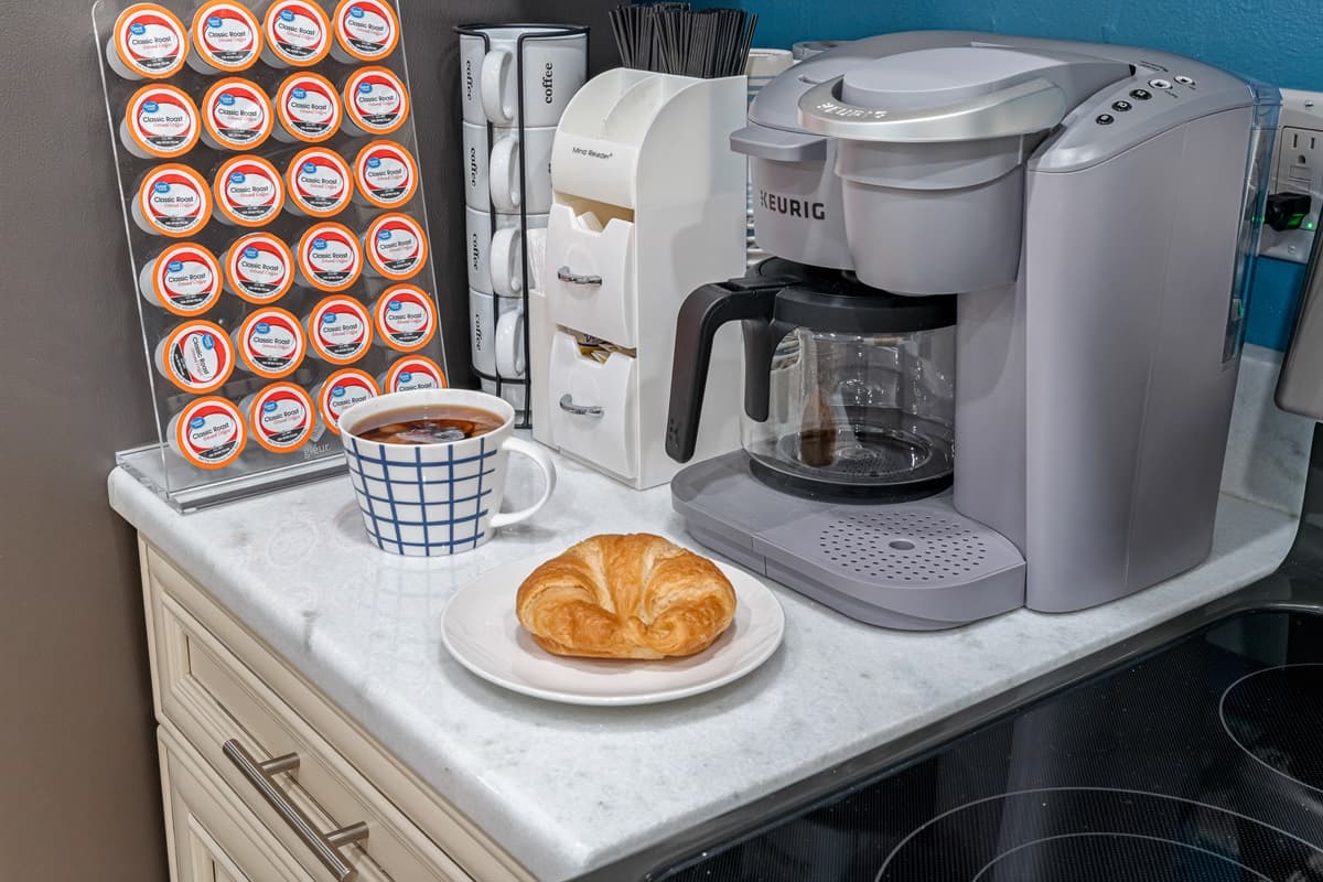 A cozy coffee station is nestled within the kitchen, creating a haven for coffee lovers and aficionados.