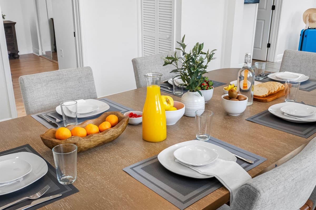 Perfect for entertaining, this dining area features a spacious table, modern chandelier, and an open-concept design.