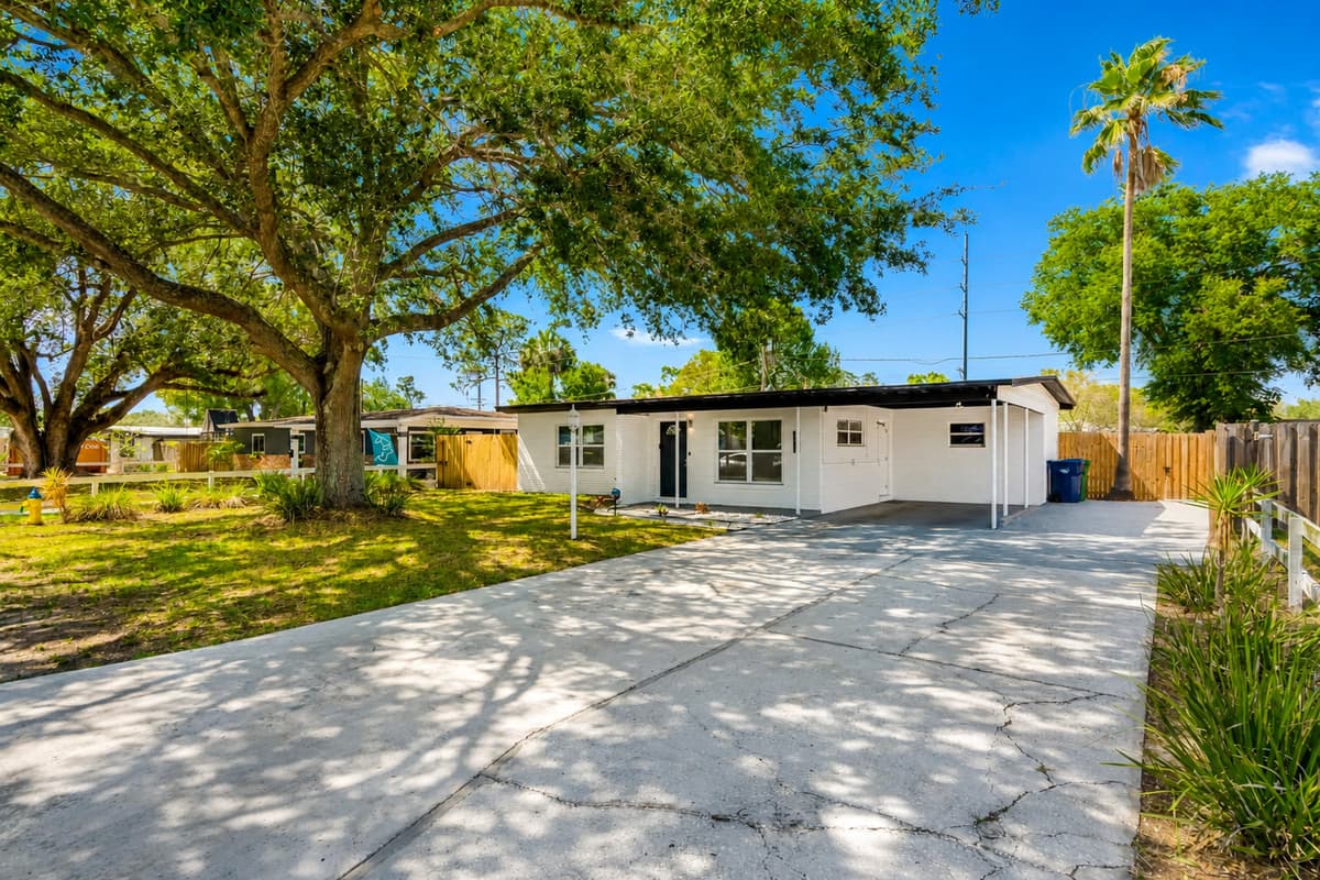 The front yard is a tranquil oasis with perfectly manicured grass that feels like walking on a soft, fluffy cloud.