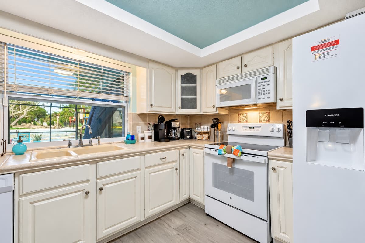The contemporary design is complemented by top-of-the-line appliances, ensuring that every cooking endeavor is met with efficiency and style.