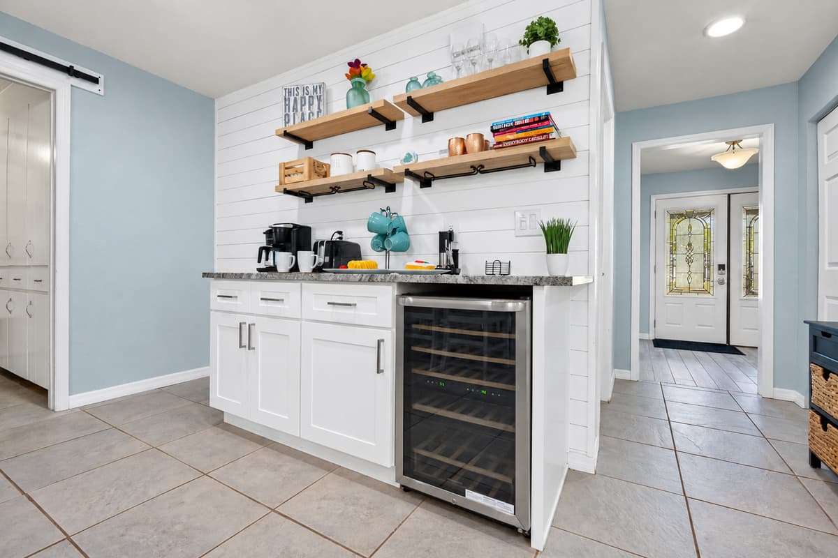 From the sleek wine cooler to the modern light fixture, every detail adds both style and function.