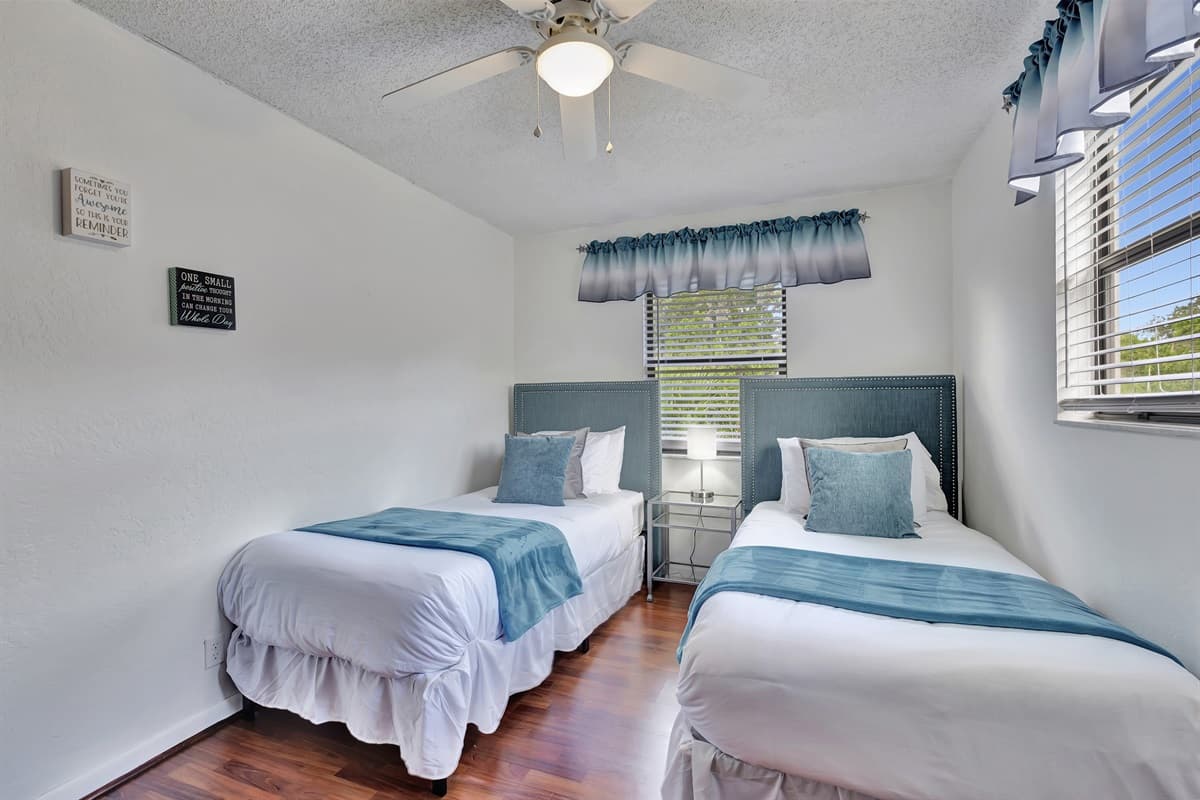 The decor in this bedroom is a delightful mix of modern and traditional elements, creating a warm and welcoming atmosphere.