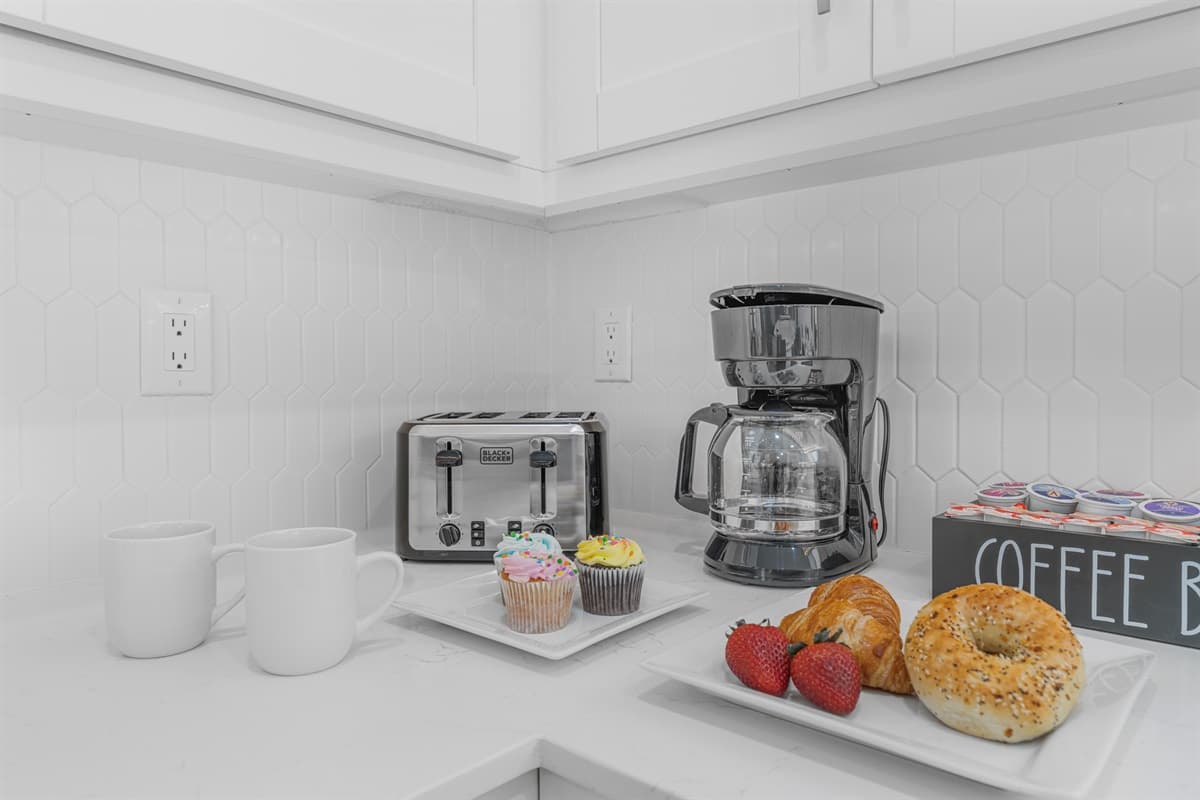 Coffee station with essentials and treats—perfect for starting your day.