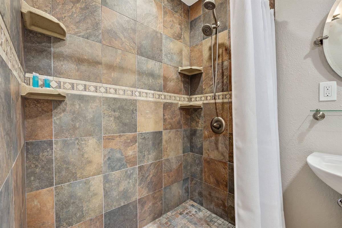 Experience the epitome of relaxation and sophistication in the en suite bathroom of the bunk bedroom